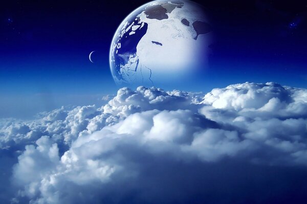 A planet with a satellite on the background of clouds
