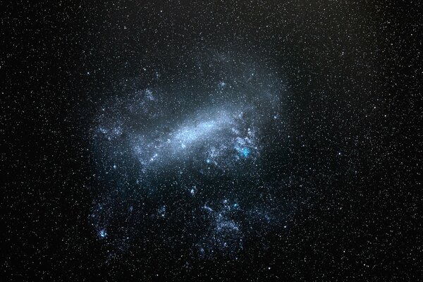 The sky in space is a night with large magellanic clouds, the stars are shining