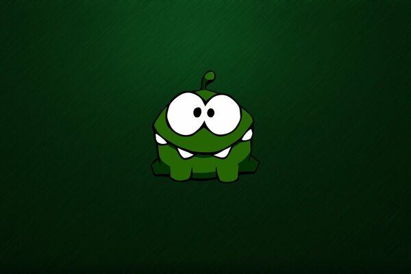 El Nibbler verde sonríe lindo. Monstruo dibujado a mano