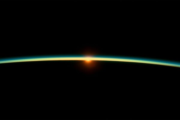 The edge of the planet from outer space. sunrise
