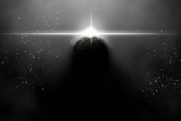 The shining of a star over a planet in space