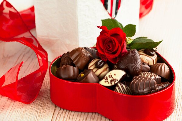 Red box with chocolates and a rose