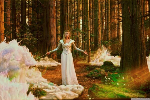 A witch in a dress in a fairy forest