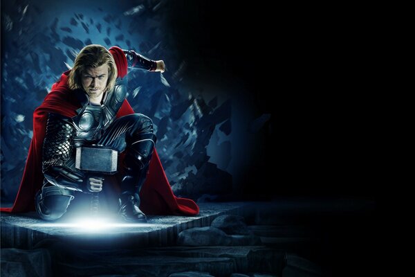 Thor with a hammer on a dark background