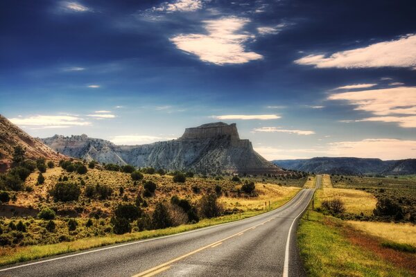 Photo of the road leading to the mountains