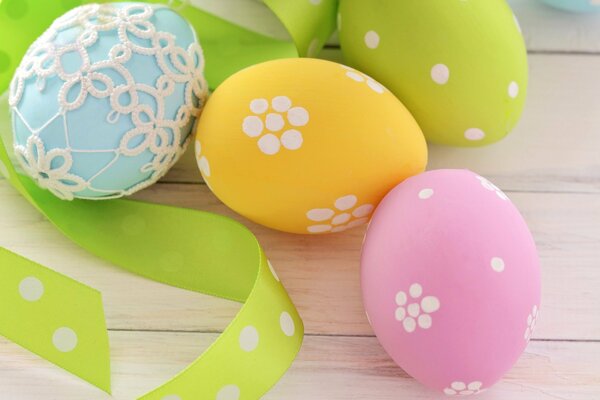 Colorful Easter eggs with green ribbon