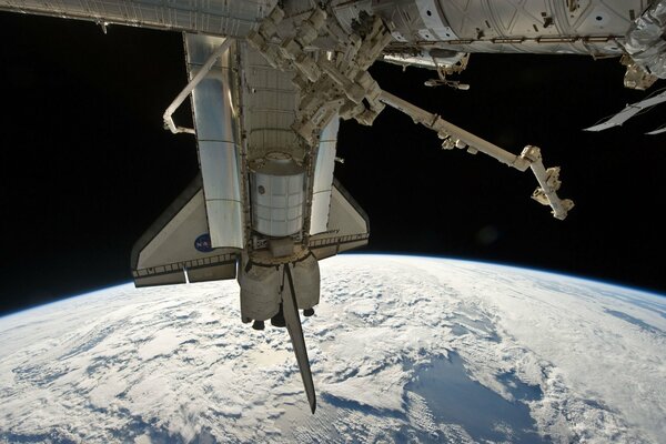 Space shuttle docking planet earth