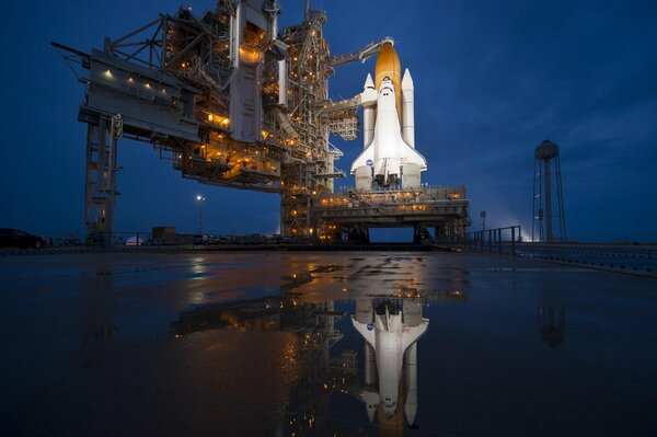 Launch pad, last flight, reflection in the water