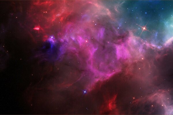 The glow of a cosmic nebula in space