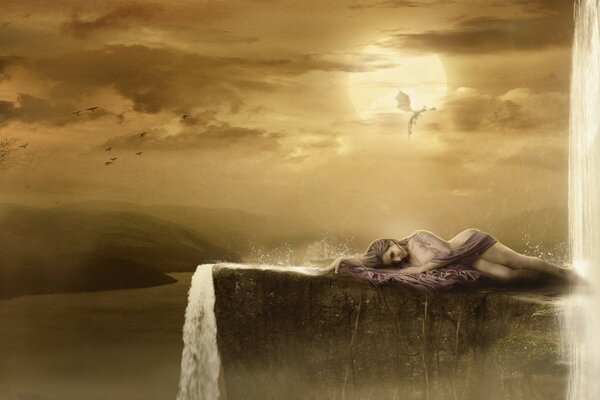 Fantasy. A girl is lying on a rock near a waterfall