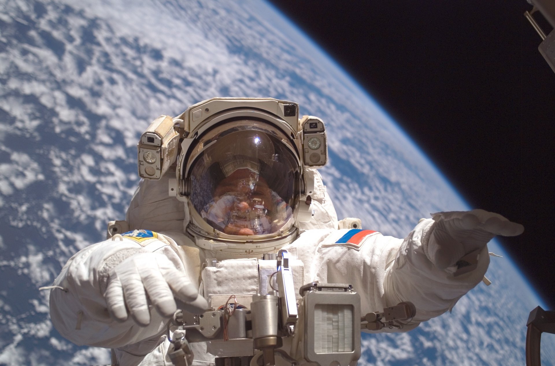 cosmonaut eva in orbit earth from space