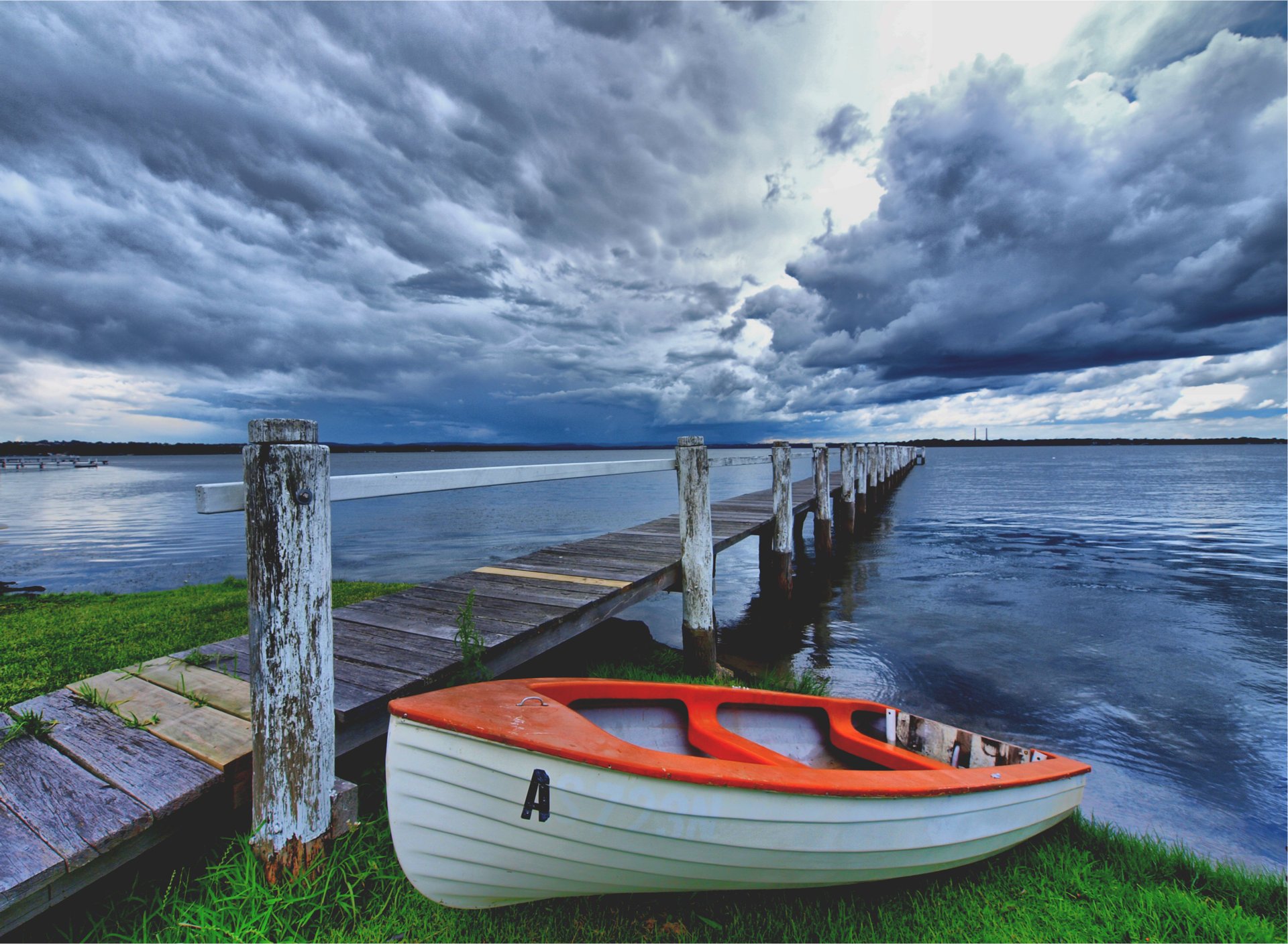 the sky storm bridge shore boat clouds lake