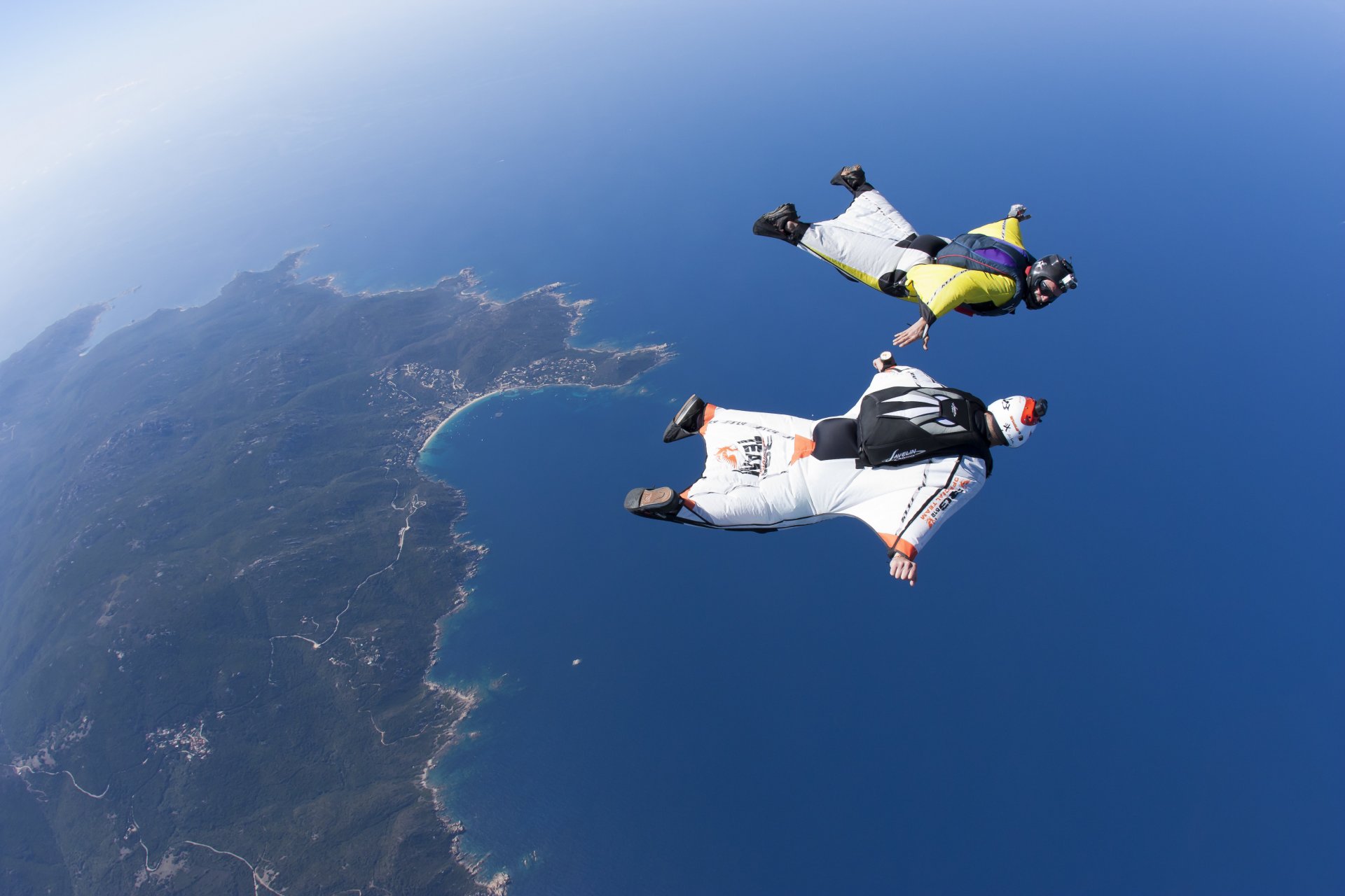 wingsuit drivers formation fs helmet camera sea sky sunny island trailers parachute extreme sport