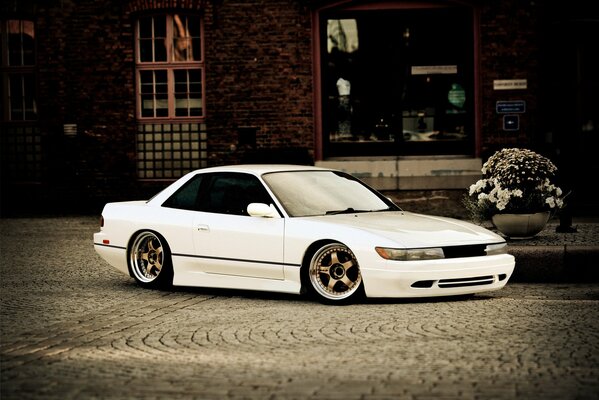 White Nissan Sylvia on a city street