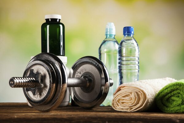 Motivation for a healthy lifestyle, namely: water, vitamins, dumbbells