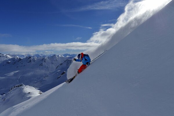 A skier descending from the mountain in winter