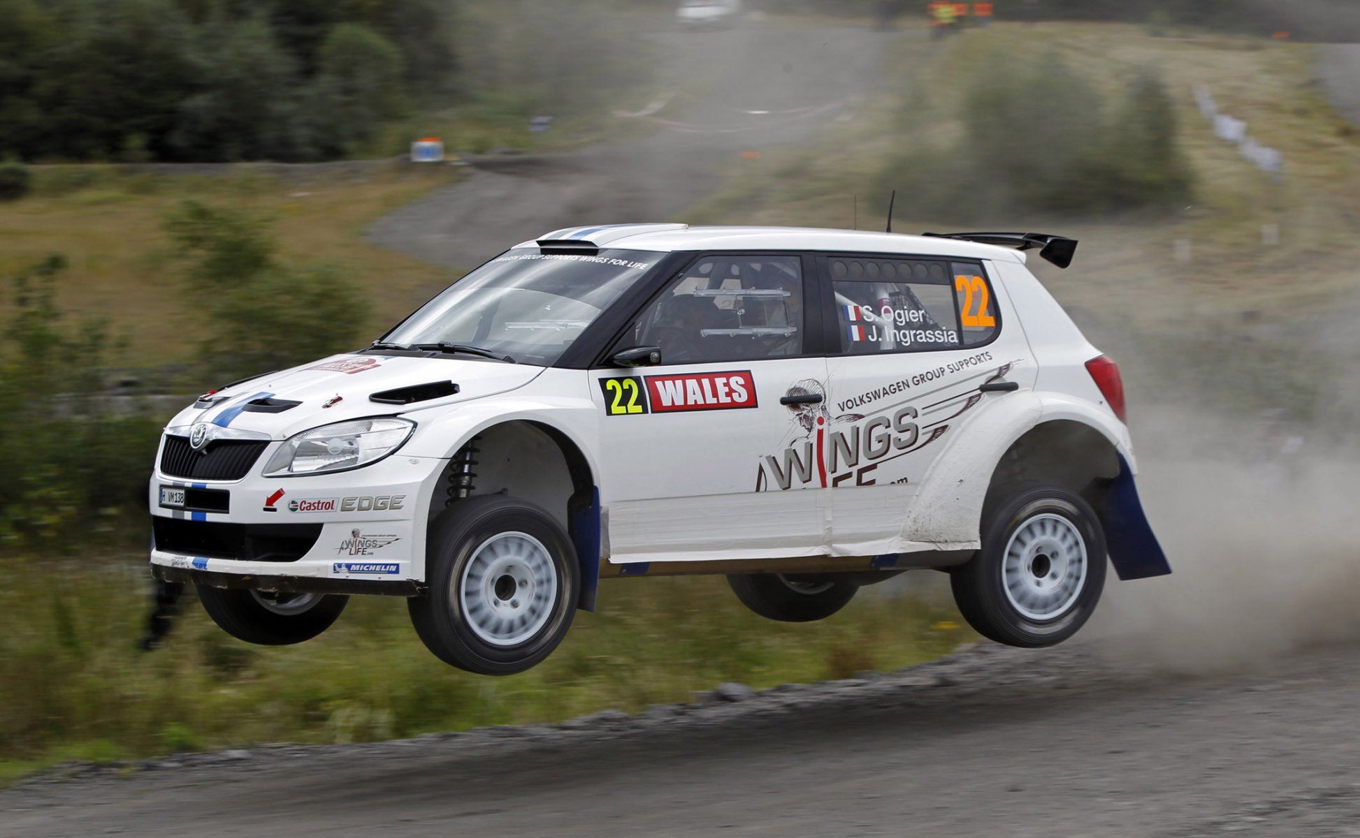 koda fabia rally wrc sebastien ogier julien ingrassia white car in the air flies speed