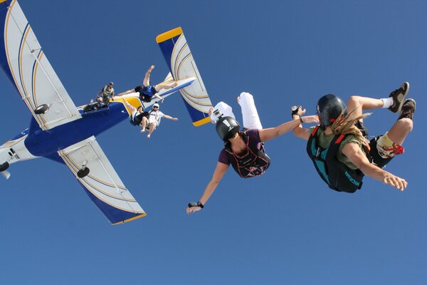 Parachutists. Jump out of the plane. Flight