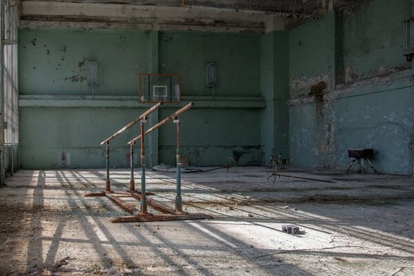 Abandoned gym photo horizontal bars. Horizontal bars photo in the gym