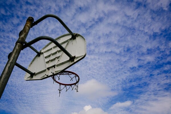 Basketball ring on the background of white clouds