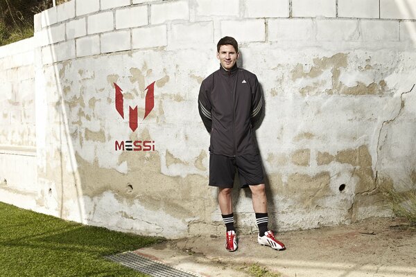 Footballer lionel Messi near the wall