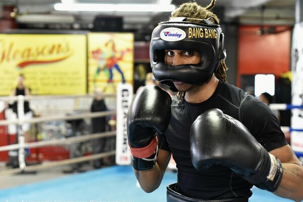 An athlete in the ring. Box. Helmet