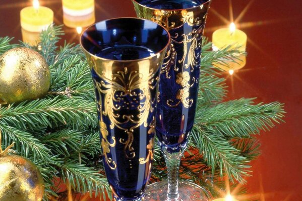 Christmas glasses with a branch of a fir tree and balls