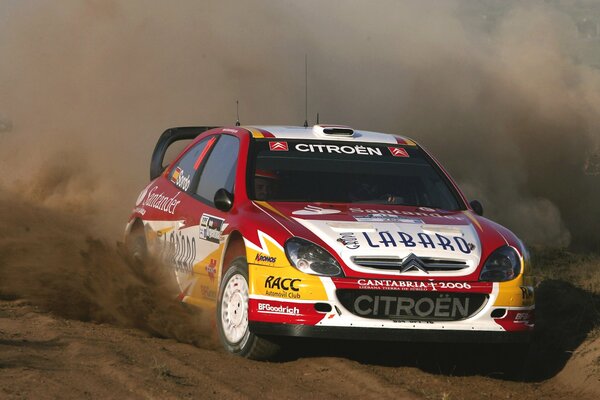 Citroen car in the dust at the rally