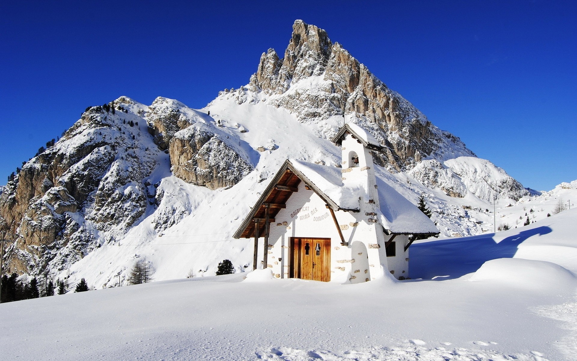 mountain sky snow house drifts winter