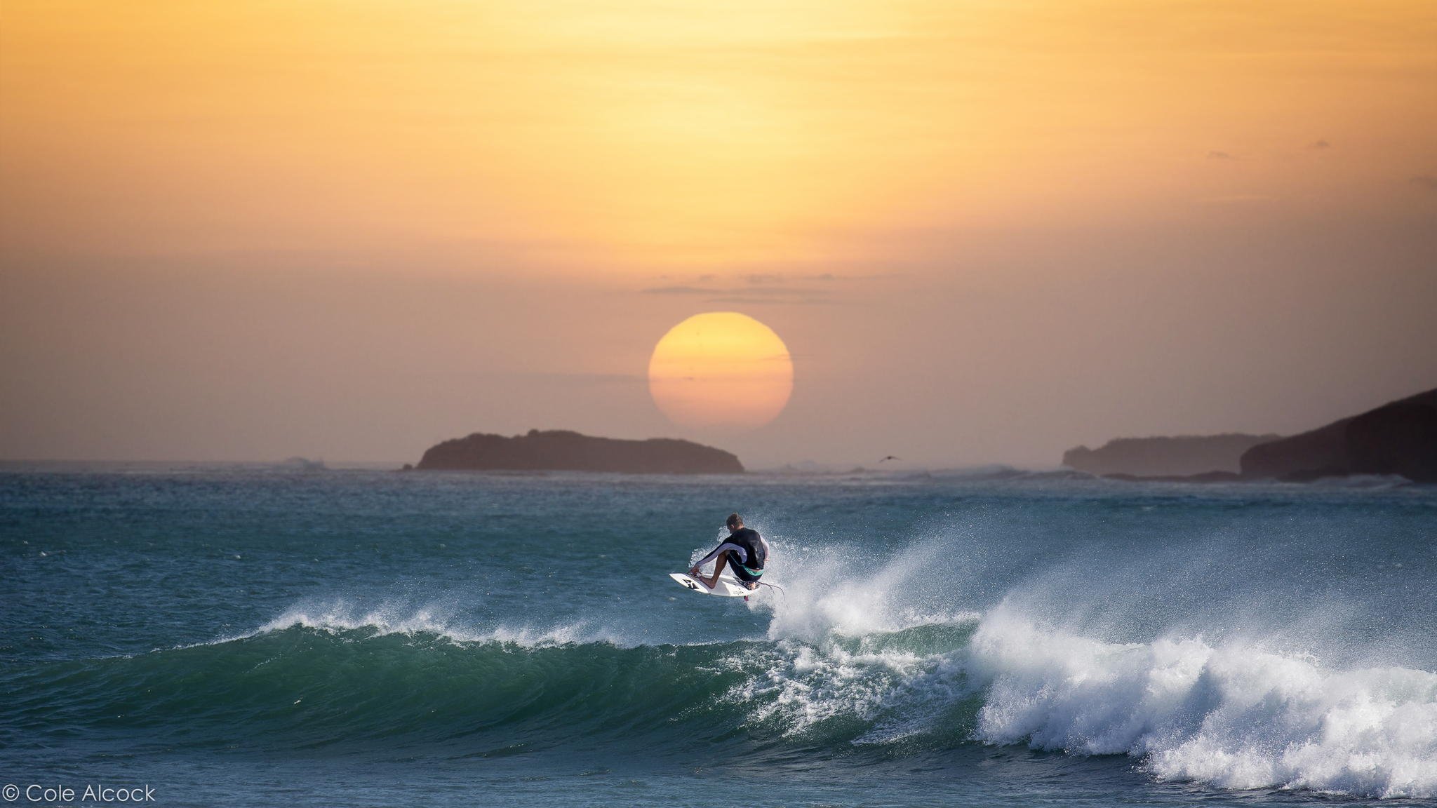 urfing waves ocean sunset