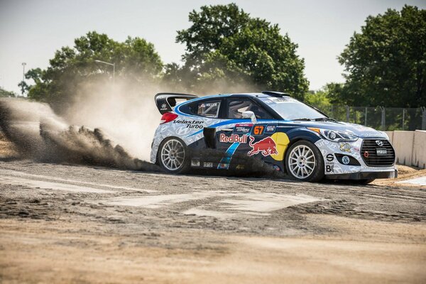 A racing car drifts on a global rally