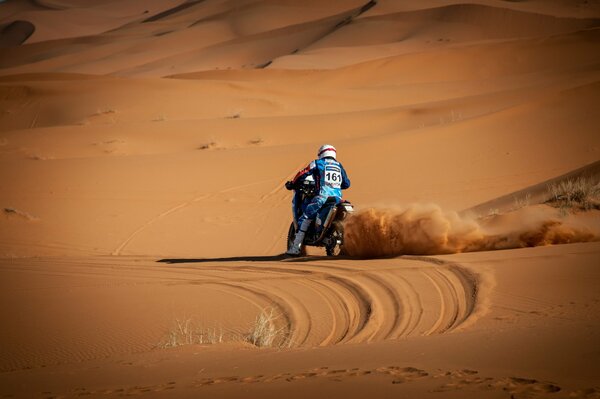 Motorcyclist in orange sands