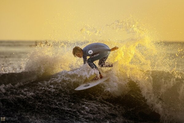 Beautiful posing on the waves of the sea