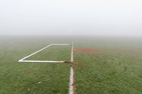 Gates. Football field and fog