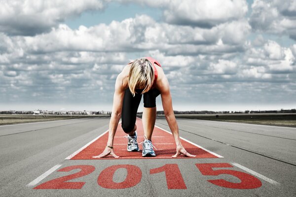 Track and field athlete in black leggings starts