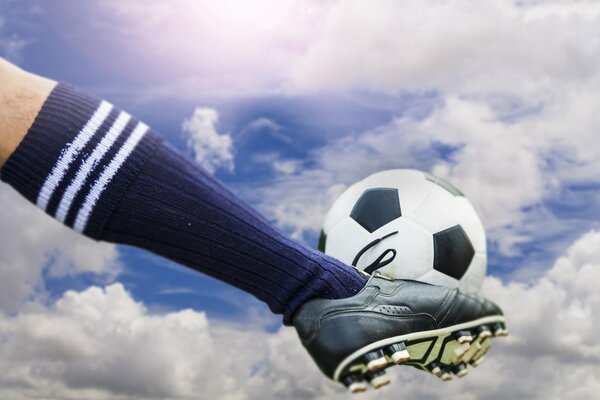 Kick the ball into the sky