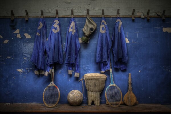 Old sports equipment on a blue background