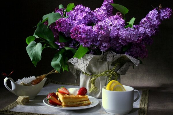 Still life with lilac flowers, excellent breakfast