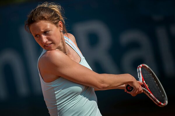 Czech tennis player hits the ball