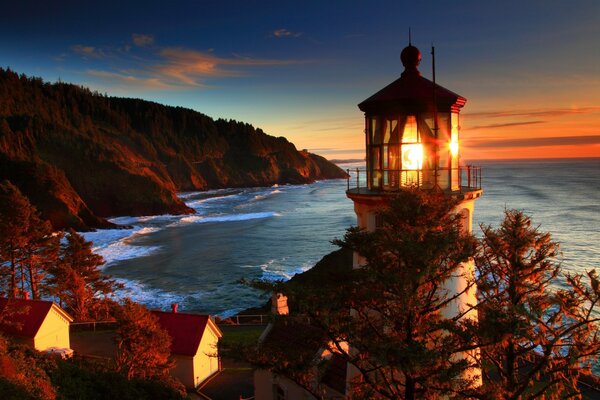 Landscape sunset sea and lighthouse