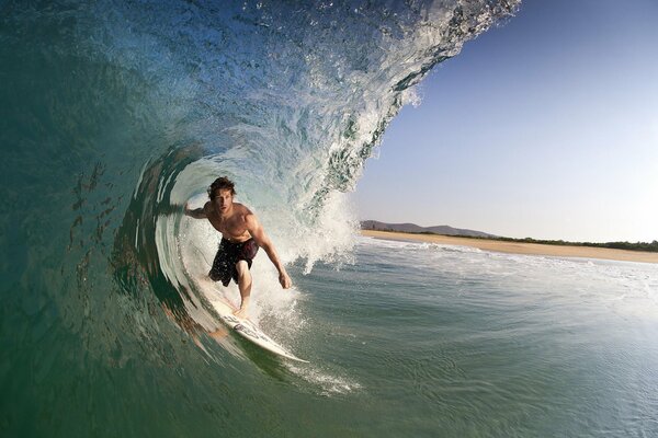 Surfer on a wave in the waters of Mexico