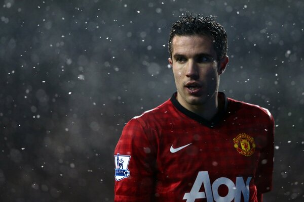 Manchester United footballer in the rain