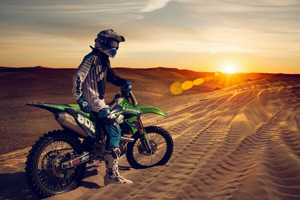 Beautiful sunset in the dunes on a sotocycle