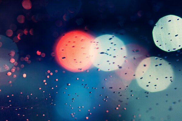 Rain falls on the background of lights wallpaper