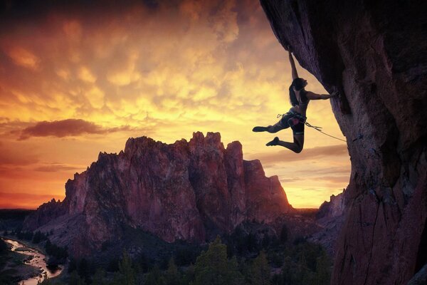 A girl is engaged in rock climbing in the mountains of Oregon