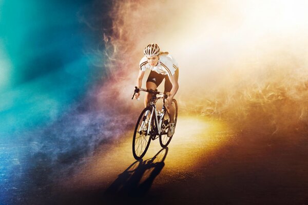 A girl on a bicycle in the fog by the light of a lantern