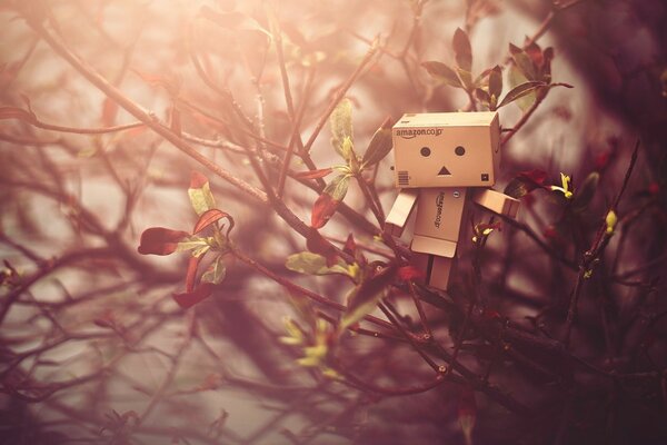 Wooden toy on an autumn maple tree