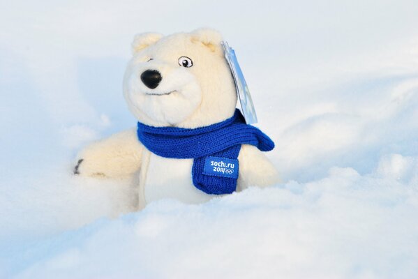 A polar bear, a toy in the snow. Symbol of the 2014 Olympics