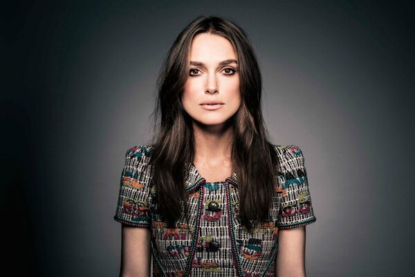 Keira Knightley in a bright shirt with her hair down