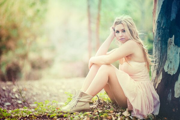 Photo shoot of Keri Ruth Garcia in a dress in the woods by a tree